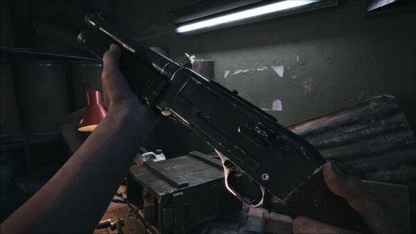 A screenshot from the game ILL showing a close-up of a shotgun being held, set in a dimly lit room with scattered items.