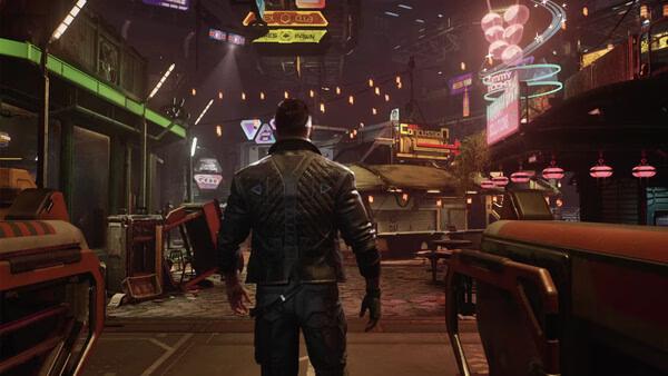 A screenshot from The Expanse: Osiris Reborn shows a character exploring a neon-lit futuristic marketplace at night.