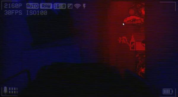 A screenshot from 'The Last Night' showing a red-lit room with a futuristic motorcycle and a digital overlay.