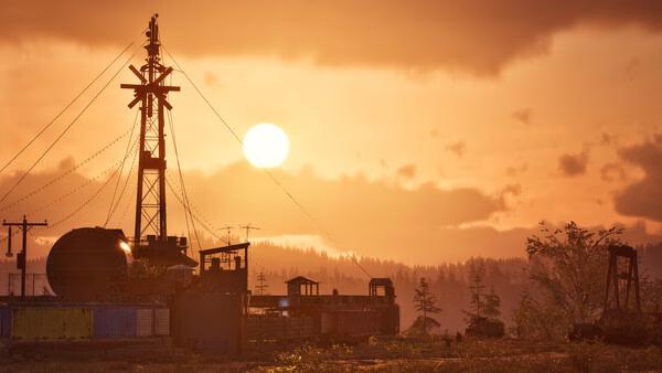 State of Decay 3 screenshot: A serene sunset over an industrial site, featuring a large tower and scattered buildings in the foreground.
