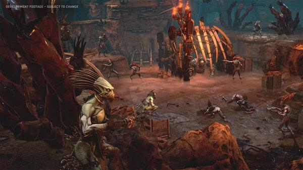 Screenshot from Warhammer 40,000: Dark Heresy showing an alien creature leading an attack in a rocky, fiery battlefield.
