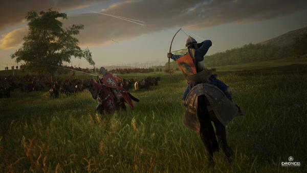 Screenshot from Chronicles: Medieval showing a mounted archer aiming at a distant cavalry charge in a grassy field.