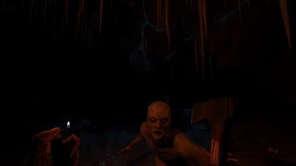 Screenshot from The Forest showing a player with a lighter facing a mutant enemy in a dark cave environment.