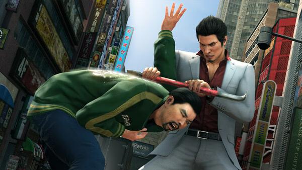 Yakuza Kiwami 2 screenshot: A man in a suit swings a crowbar at another man in a green jacket on a bustling city street.