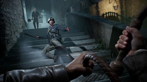 Screenshot from "Indiana Jones and the Great Circle" showing Indiana with a whip, facing two men on a shadowy staircase.