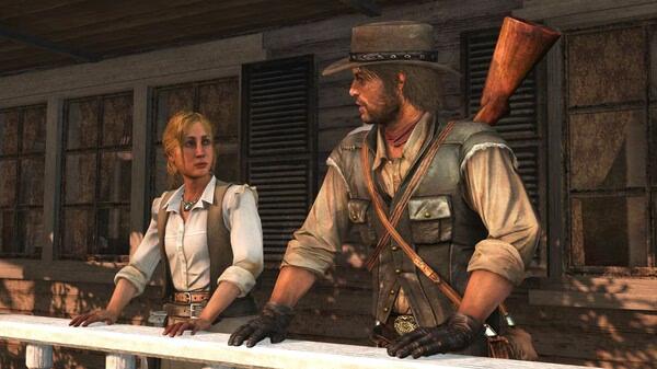 Red Dead Redemption screenshot: Two characters stand on a wooden porch, one holding a rifle on their back, with a rustic building behind them.