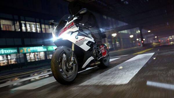 A screenshot from Need for Speed Unbound showing a motorcycle with glowing headlights on a wet street at night.