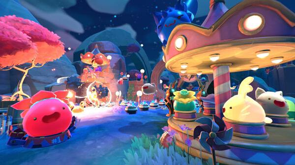 Slime Rancher 2 screenshot: A vibrant amusement park scene with colorful slimes on a carousel at night under a starry sky.