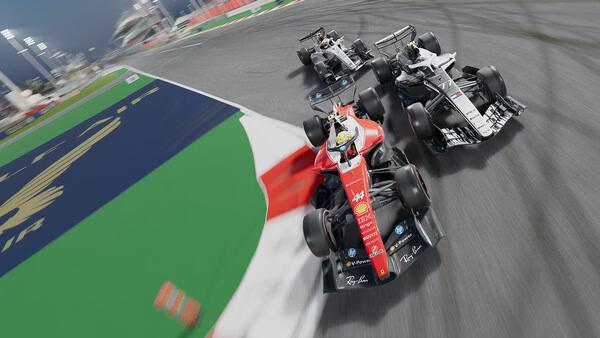 F1 25 screenshot: Three race cars speed around a sharp track corner, with tire marks visible on the asphalt.