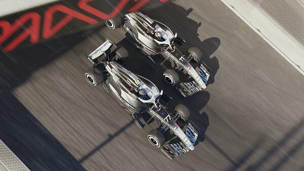 F1 25 screenshot: Two racing cars speed down a track side by side, showcasing intense competition and dynamic motion.