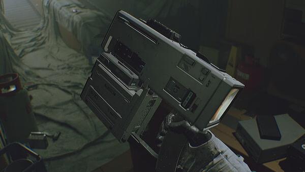 ROUTINE screenshot: A hand in a spacesuit holding a large, futuristic device amidst a cluttered, dimly lit room.
