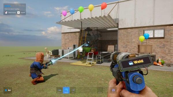 s&box screenshot: A player uses a tool to weld objects in a workshop with balloons, while another player stands nearby.
