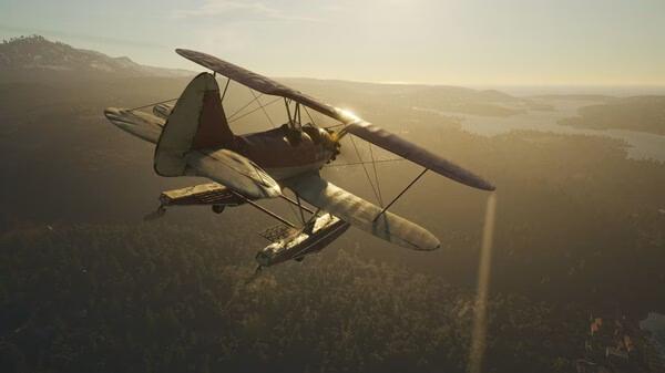 A biplane soars over a sunlit landscape with forests and lakes in a SCUM game screenshot.