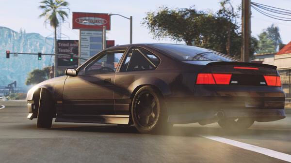 A BeamNG.drive screenshot showing a sleek black car drifting on a sunny urban street with palm trees and traffic lights.