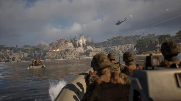Squad screenshot: Soldiers in a boat approach a shore under attack, with explosions and a helicopter visible in the background.