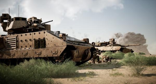 A Squad screenshot showing armored vehicles and soldiers in a desert environment with smoke rising in the background.