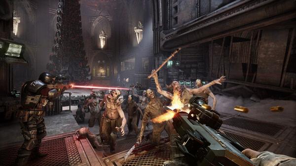 Screenshot from Warhammer 40,000: Darktide showing players battling a horde of enemies in a dimly lit, industrial setting.