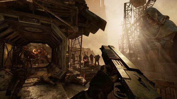 Screenshot from Warhammer 40,000: Darktide showing players in combat against monstrous enemies in an industrial, dystopian landscape.