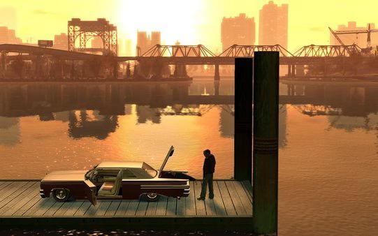 Grand Theft Auto IV screenshot: A character stands near a classic car with its trunk open on a dock, overlooking a sunset-lit cityscape.