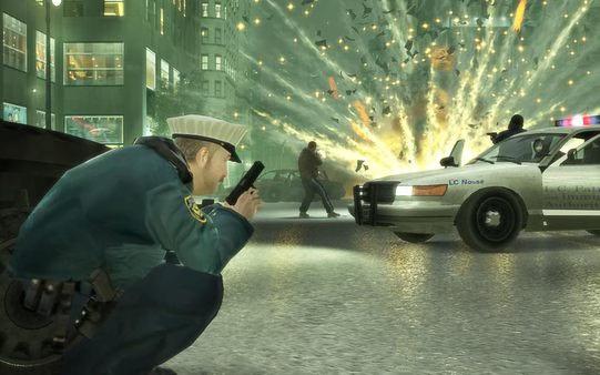 A screenshot from Grand Theft Auto IV showing a police officer crouched with a pistol as a car explodes in a city street.