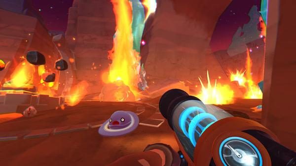 Screenshot from Slime Rancher showing a player aiming a weapon at a purple slime with flames erupting in the background.