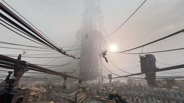 Screenshot from Half-Life: Alyx showing a towering Combine structure looming over a cityscape with cables stretching across rooftops.