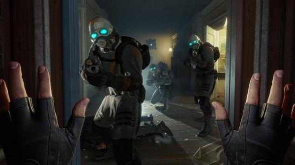 Half-Life: Alyx screenshot: Three armored soldiers with glowing goggles aim weapons in a hallway as gloved hands appear in the foreground.