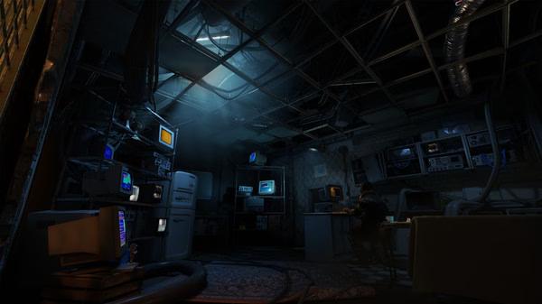 A dimly lit room filled with computers and monitors in Half-Life: Alyx, with a character working at a desk. Game screenshot.