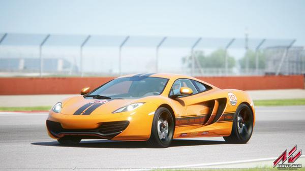 Screenshot from Assetto Corsa showing an orange sports car speeding on a race track with a blurred background.