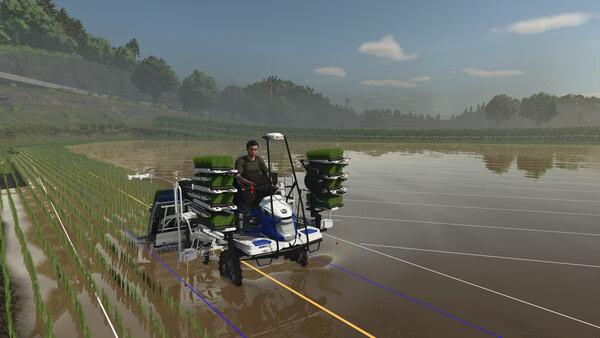 Farming Simulator 25 screenshot: A farmer operates a rice planter in a flooded field, surrounded by lush greenery and a clear sky.