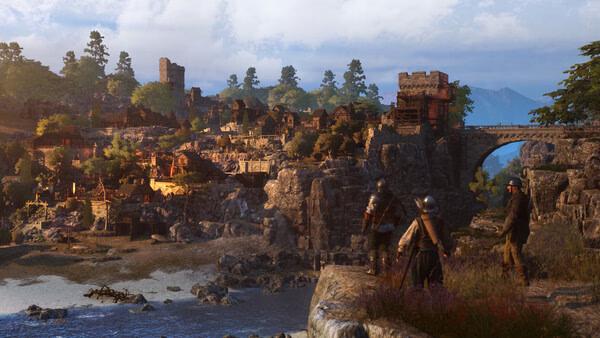Bellwright screenshot: Three characters overlook a medieval town with stone buildings, a bridge, and lush surroundings.