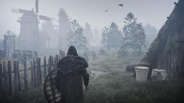 Bellwright screenshot: A hooded figure with a shield stands in a foggy village, near wooden fences and a windmill in the distance.