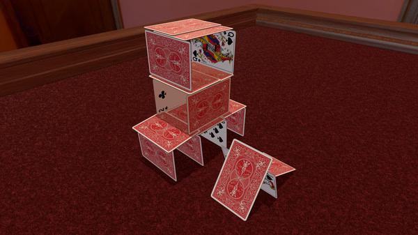 Tabletop Simulator screenshot: A house of cards built with red playing cards stands on a wooden table in a virtual environment.
