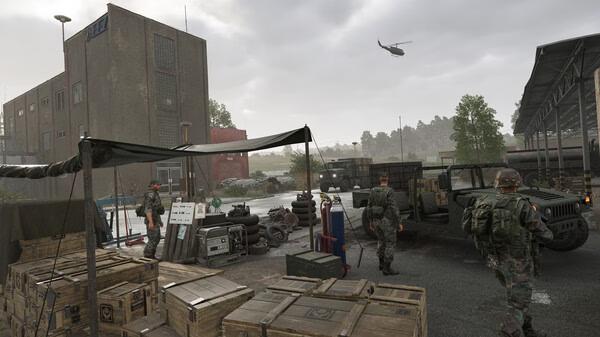 Arma Reforger screenshot: Soldiers in a military base with supplies, vehicles, and a helicopter flying overhead in cloudy weather.