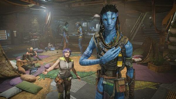 Screenshot from Avatar: Frontiers of Pandora showing a Na'vi and a human in a bustling room with various characters and objects.