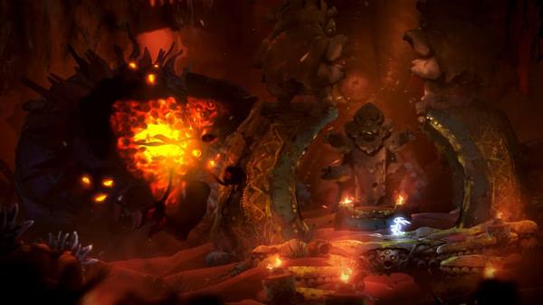 Screenshot from Ori and the Will of the Wisps showing Ori facing a fiery creature in a glowing, cavernous environment.