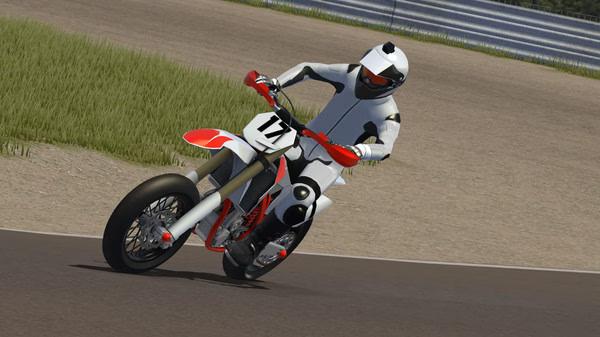 MX Bikes screenshot: A motocross rider in white gear and helmet takes a sharp turn on a paved track, showcasing dynamic racing action.