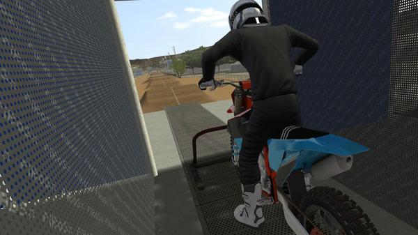 Screenshot from MX Bikes showing a motorcyclist preparing for a race on a dirt track.