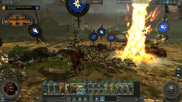 Screenshot from Total War: WARHAMMER II showing a battlefield with dinosaurs and soldiers in combat near a towering flame.