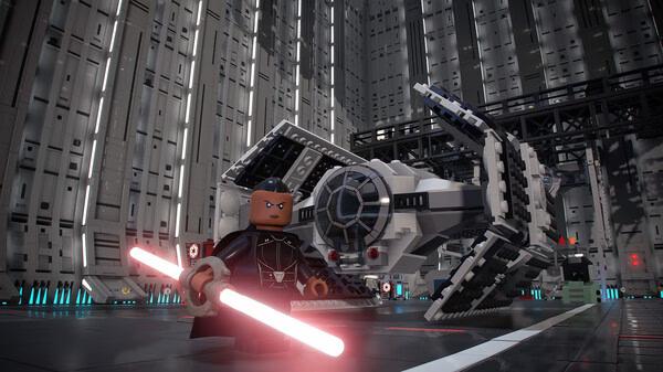 LEGO Star Wars: The Skywalker Saga screenshot showing a character with a red lightsaber near a LEGO TIE Fighter in a hangar.