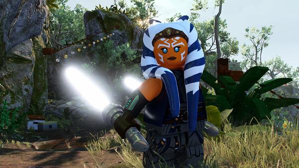 LEGO Star Wars: The Skywalker Saga screenshot featuring a LEGO character wielding dual lightsabers in a lush, forested environment.
