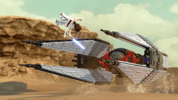 LEGO Star Wars: The Skywalker Saga screenshot featuring Rey leaping with a lightsaber near a starship in a desert landscape.