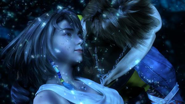 Screenshot from FINAL FANTASY X/X-2 HD Remaster showing two characters, one embracing the other, surrounded by glowing blue particles.