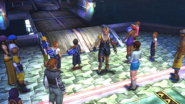 A screenshot from FINAL FANTASY X/X-2 HD Remaster shows Tidus and Yuna surrounded by villagers on a dock at night.