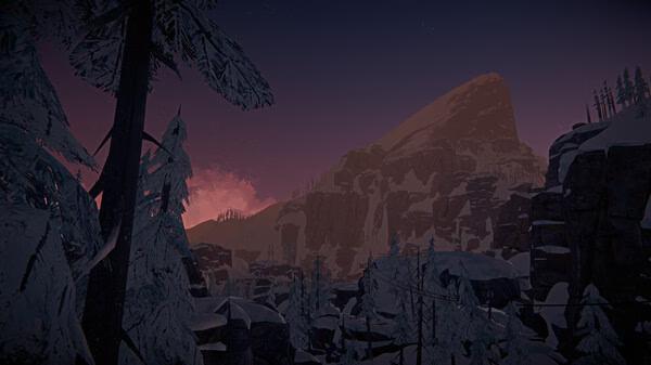 Screenshot from The Long Dark showing a snowy mountain landscape at dusk, with trees and rocky cliffs silhouetted against a colorful sky.