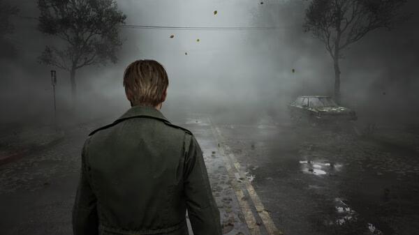 Silent Hill 2 screenshot: A man in a green jacket stands on a foggy road, facing an abandoned, weathered car surrounded by eerie mist.