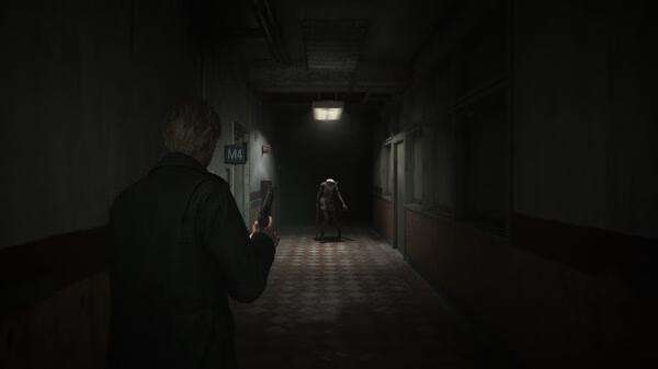 Silent Hill 2 screenshot: A character with a flashlight approaches a creature in a dimly lit hallway, creating a tense atmosphere.