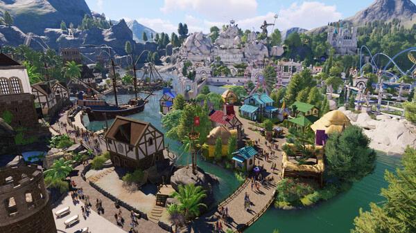 Planet Coaster 2 screenshot showing a vibrant theme park with medieval-style buildings, a pirate ship, and roller coasters in a lush landscape.
