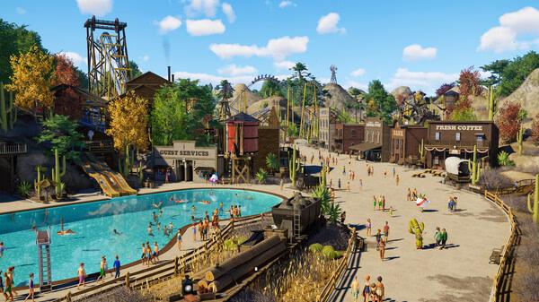Screenshot from Planet Coaster 2 showing a vibrant western-themed park with a pool, guest services, and visitors exploring the area.