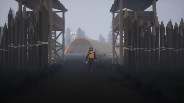 Screenshot from SurrounDead showing a lone survivor with a backpack walking towards a fortified camp under a foggy sky.